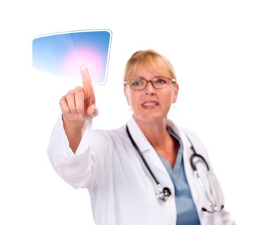 Attractive female doctor touching button on touch screen