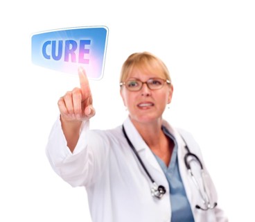 Attractive female doctor touching a cure button on touch screen