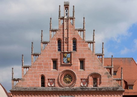 Town hall gable with town hall clock and town coat of arms of the historical town hall