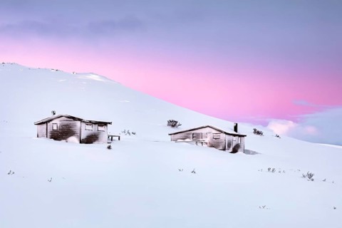 Cabins in winter landscape