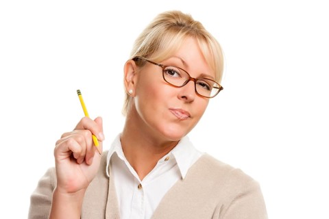 Beautiful woman with questioning expression holding pencil isolated on A white background