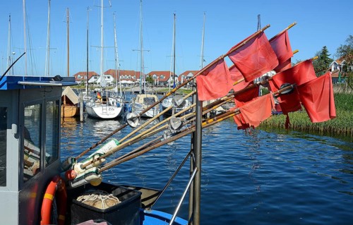 Red fishing flags at the seaside resort of Rerk