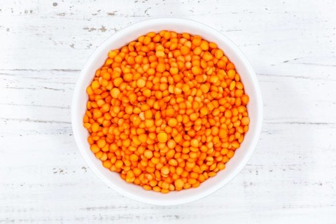 Red lentils raw from top wooden board in Germany