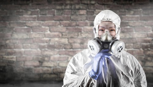Chinese woman wearing hazmat suit