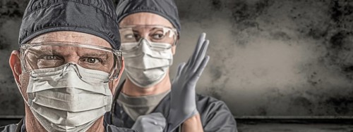 Female and male doctors or nurses wearing scrubs and protective mask and goggles banner