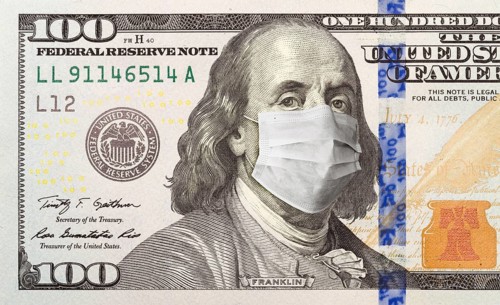 One hundred dollar bill with medical face mask on face of benjamin franklin