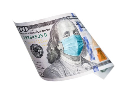 One hundred dollar bill with medical face mask on benjamin franklin isolated on white