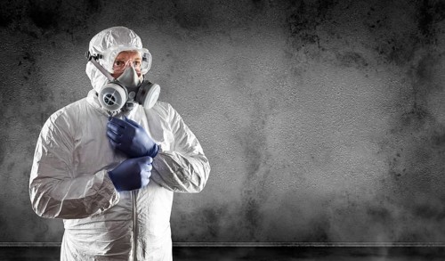 Man wearing hazmat suit