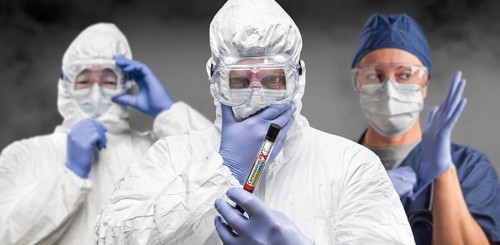 Team of doctors or nurses in hazmat gear holding positive coronavirus test tube banner