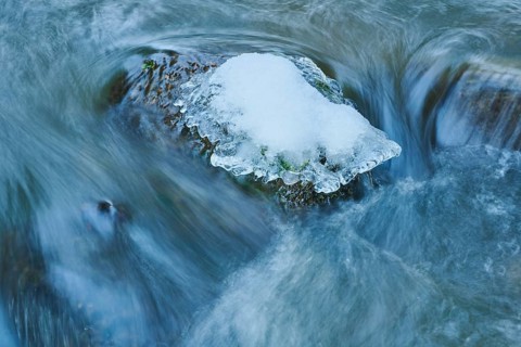 Icicles on wild river in nature reserve Hoelle