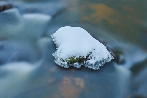 Icicles on wild river in nature reserve Hoelle