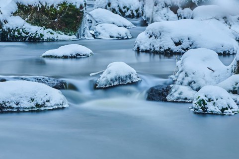 Icicles on wild river in nature reserve Hoelle