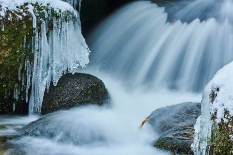 Icicles on wild river in nature reserve Hoelle