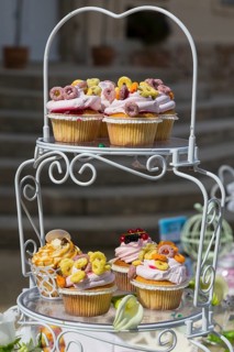 Vintage etagere with cupcakes on a candy bar