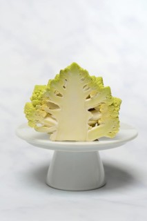 Halved cauliflower Romanesco on a decorative plate