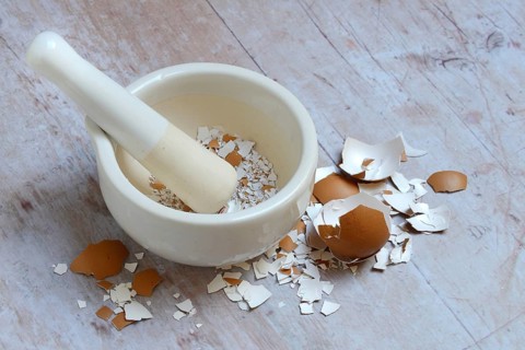 Broken eggshells crushed with mortar