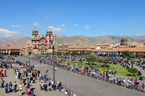 Plaza de Armas with Cathedral Catedral Basilica de la Virgen de la Asuncion in front of a parade