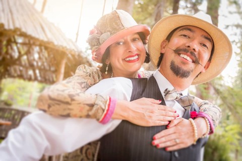 Attractive 1920s dressed romantic couple flirting outdoors