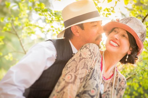 Attractive 1920s dressed romantic couple flirting outdoors