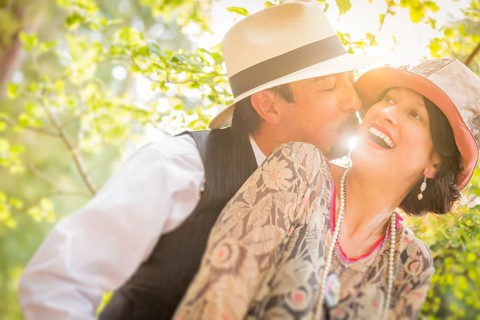 Attractive 1920s dressed romantic couple flirting outdoors