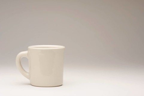 Blank coffee cup on a gradating background