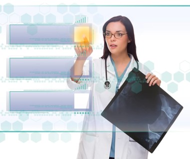 Young doctor or nurse with x-ray pushing blank button on futuristic translucent panel