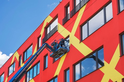 Colorful facade with window cleaners