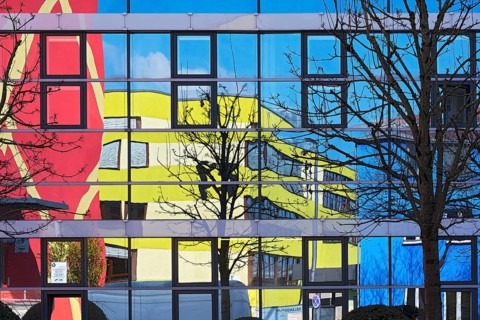 Colorful facades reflected in windows