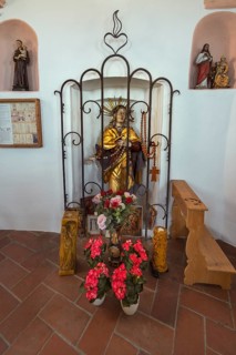 Figure of a saint with floral decoration