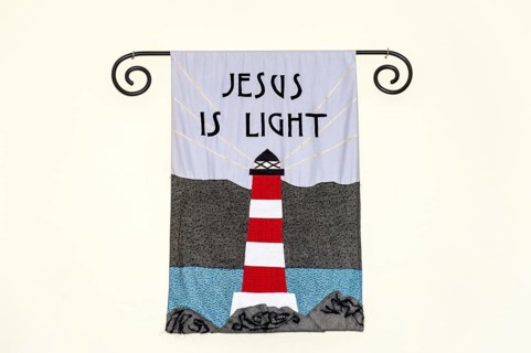 Mural with lighthouse and inscription Jesus is light in Bressay-Kirk church