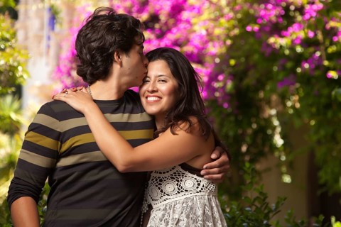 Happy attractive hispanic couple enjoying themselves at the park