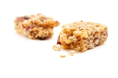 Broken granola bar isolated on a white background