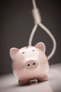 Piggy bank with hangman's noose behind on grey background