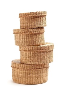 Stack of various sized wicker baskets isolated on white