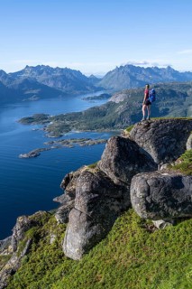 Young hiker looking at mountain panorama