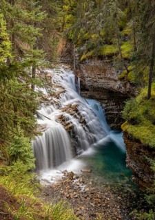 Waterfall flowing in cascades