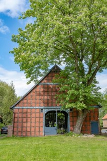 Half-timbered house in the round village of Satemin