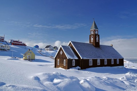 Wooden church in winter landscape