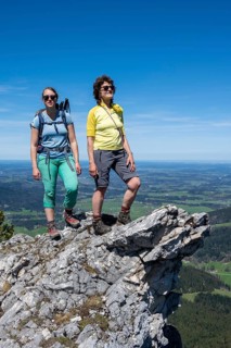 Two female hikers looking over the alpine foothills