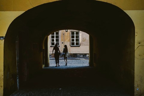 Girls coming out of the yard gate
