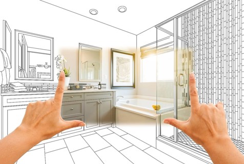 Hands framing custom master bathroom photo section with drawing behind