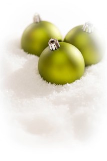Beautiful matt green christmas ornaments on snow flakes room for your own text