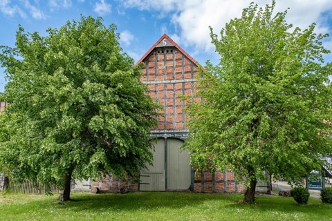 Half-timbered house in the round village of Satemin