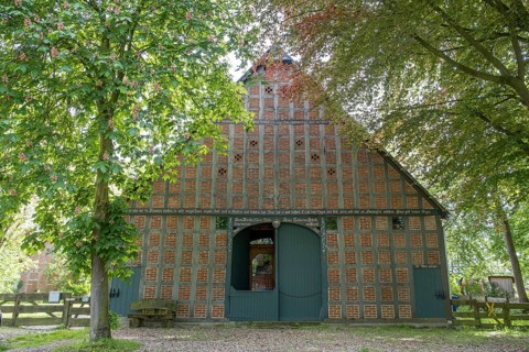 Half-timbered house in the round village Satemin