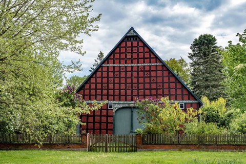 Half-timbered house in the round village of Satemin