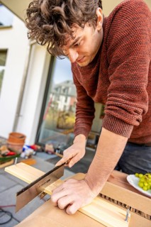 Young man doing DIY in his apartment