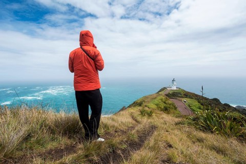 Guy infront of Cape Reinga Lighthouse