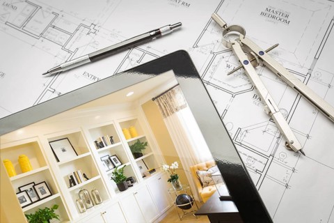 Computer tablet with finished built-in shelves and cabinets over house plans