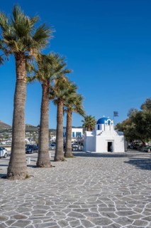 Blue and White Greek Orthodox Church Agios Nikolaos with Greek Flag