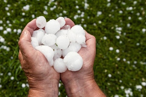 Golfball-sized hailstones in hands